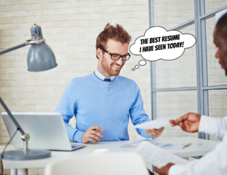 happy man looking at a resume