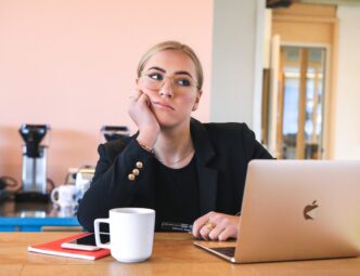 woman bored sitting at laptop